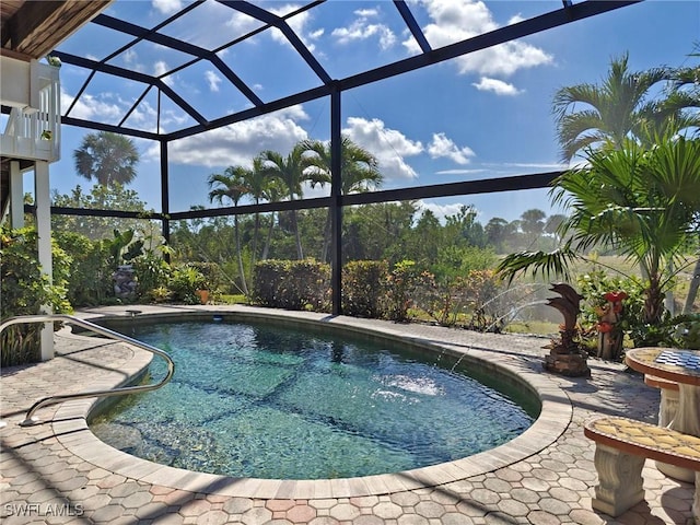 outdoor pool featuring a patio and a lanai