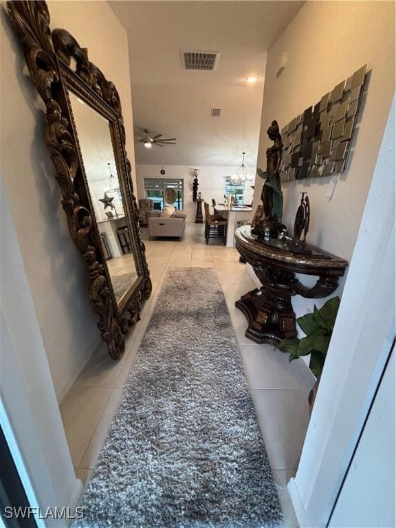 corridor with tile patterned floors and visible vents