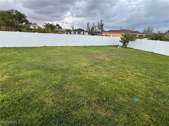 view of yard featuring a fenced backyard