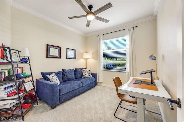 office area with a ceiling fan, carpet, baseboards, and ornamental molding