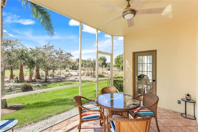 sunroom / solarium with ceiling fan