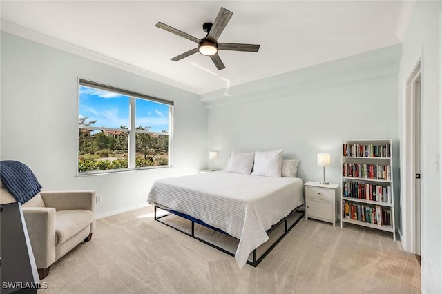 bedroom featuring baseboards, light colored carpet, ornamental molding, and a ceiling fan