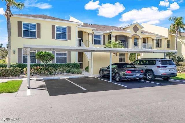 view of front of property with covered parking and stucco siding