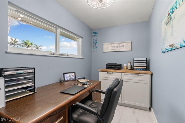 office area with light wood-style floors