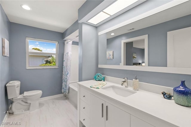 bathroom featuring toilet, shower / bath combo, recessed lighting, baseboards, and vanity