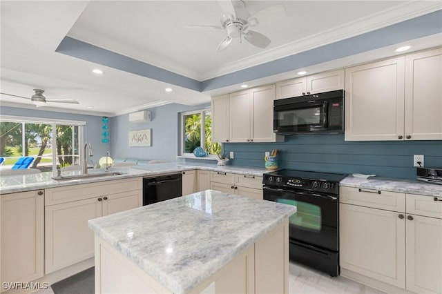 kitchen featuring a healthy amount of sunlight, black appliances, ceiling fan, and a sink