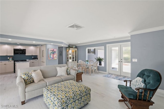 living room featuring visible vents, baseboards, ornamental molding, recessed lighting, and french doors