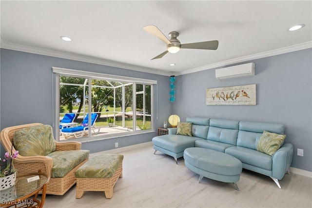 living area featuring a wall mounted air conditioner, ornamental molding, a ceiling fan, wood finished floors, and baseboards