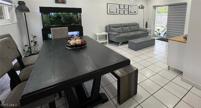 dining space with light tile patterned floors