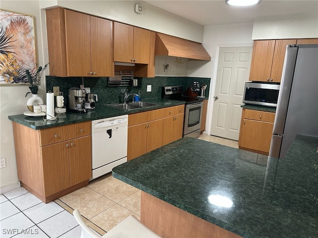 kitchen featuring custom exhaust hood, backsplash, stainless steel appliances, and light tile patterned flooring