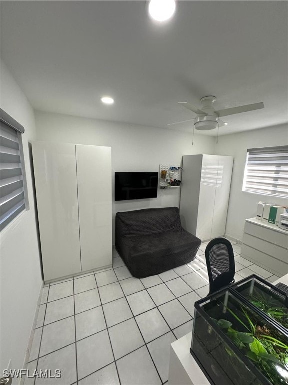 bedroom featuring light tile patterned floors, a ceiling fan, and recessed lighting