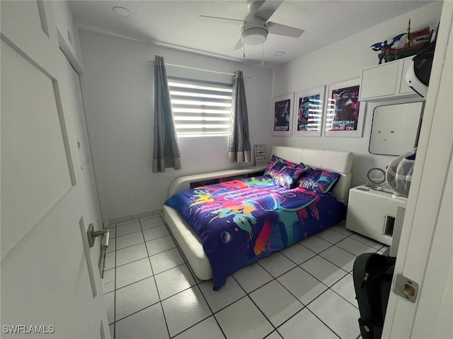 bedroom with ceiling fan and light tile patterned flooring