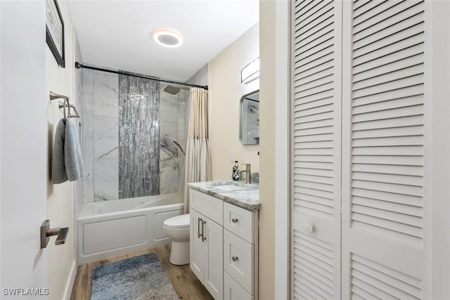 17450 Taylor Rd, Alva, FL 33920 - full bath featuring toilet, shower / tub combo with curtain, wood finished floors, a closet, and vanity