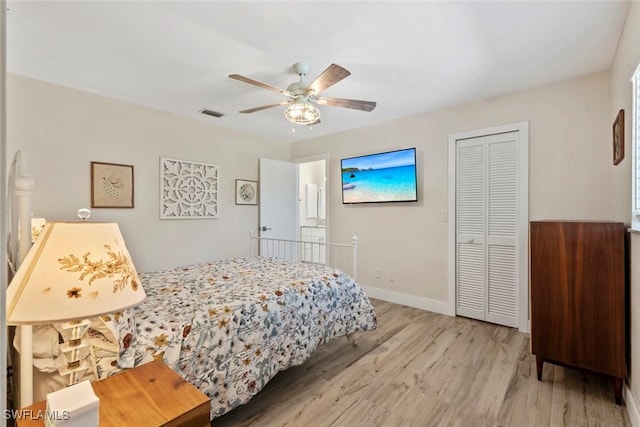 17450 Taylor Rd, Alva, FL 33920 - bedroom featuring visible vents, baseboards, wood finished floors, a closet, and a ceiling fan