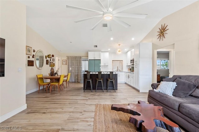 17450 Taylor Rd, Alva, FL 33920 - living area featuring visible vents, lofted ceiling, light wood-style flooring, and a ceiling fan