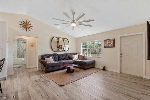 17450 Taylor Rd, Alva, FL 33920 - living room featuring light wood-style flooring, baseboards, ceiling fan, and vaulted ceiling
