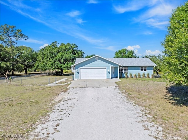 17450 Taylor Rd, Alva, FL 33920 - ranch-style house featuring a front lawn, gravel driveway, a garage, and fence