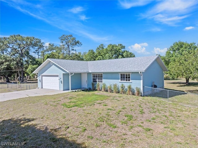 17450 Taylor Rd, Alva, FL 33920 - ranch-style house with a front yard, concrete driveway, a garage, and fence