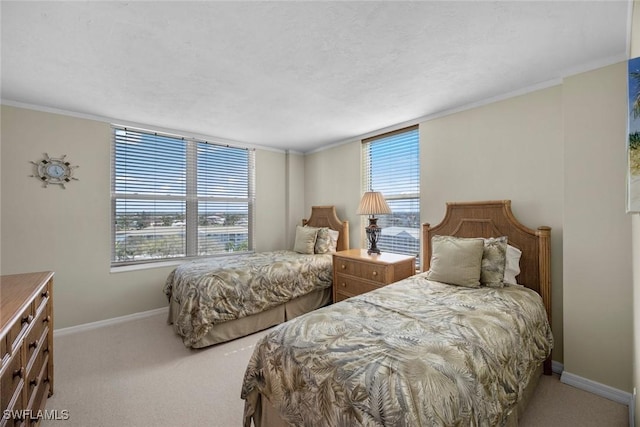 bedroom with baseboards, carpet, and ornamental molding