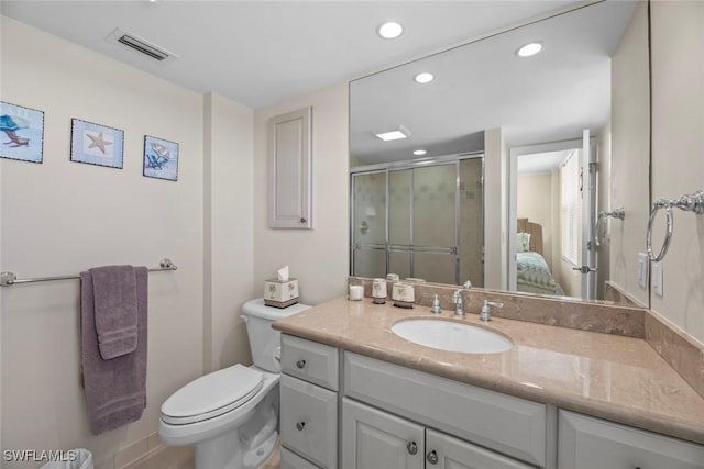 bathroom featuring visible vents, toilet, ensuite bathroom, a shower stall, and vanity