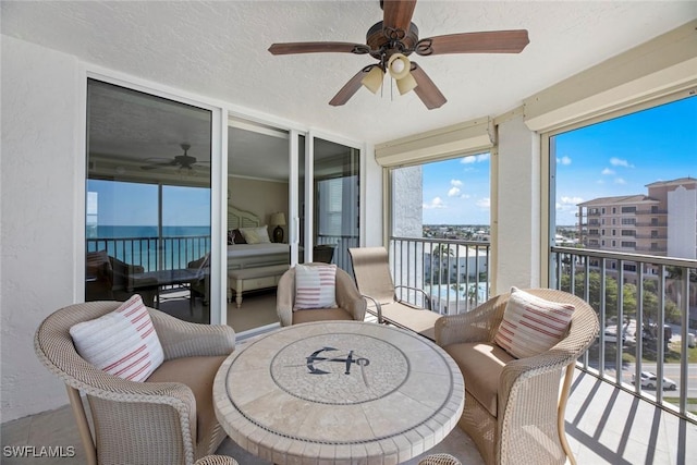 sunroom with a ceiling fan