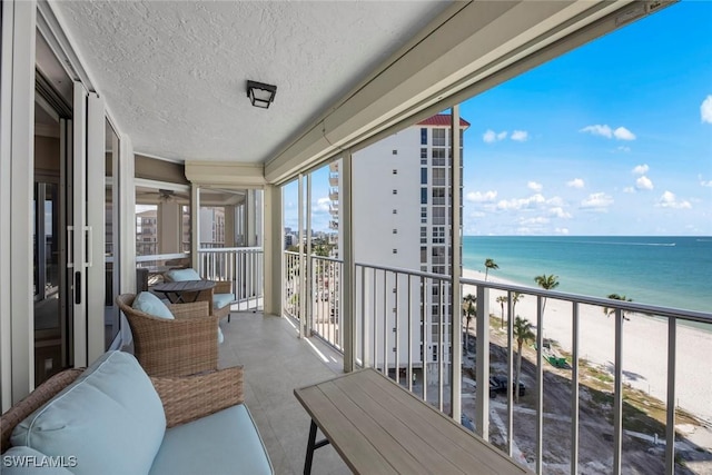 balcony with a view of the beach and a water view