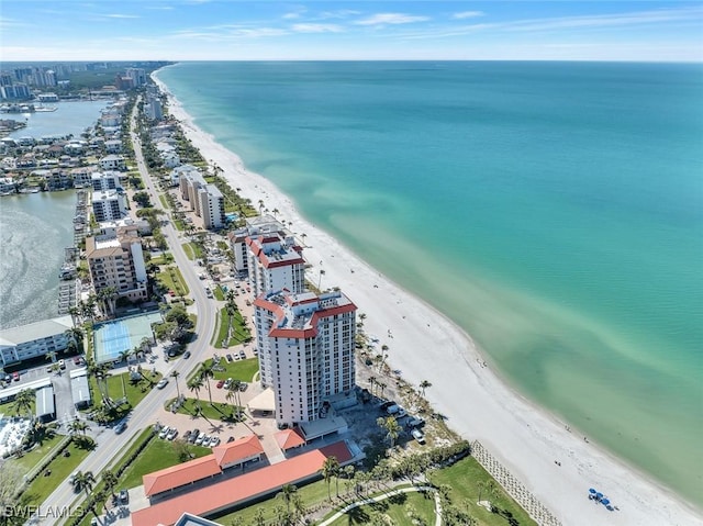 aerial view featuring a view of city, a beach view, and a water view