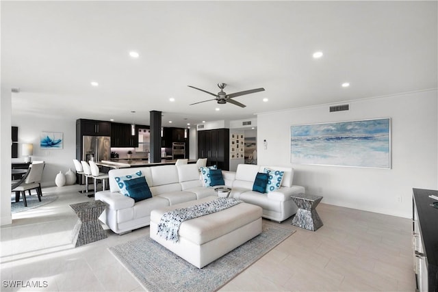 living area with visible vents, recessed lighting, and a ceiling fan