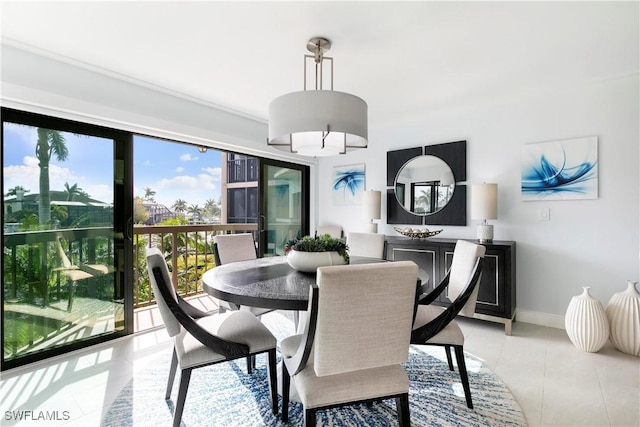 dining area with light tile patterned floors and baseboards