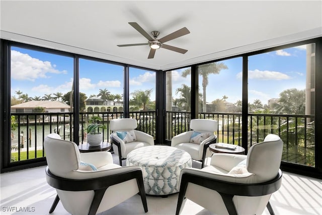 sunroom with a ceiling fan and a wealth of natural light