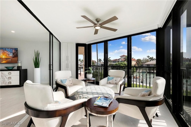 sunroom / solarium with a ceiling fan