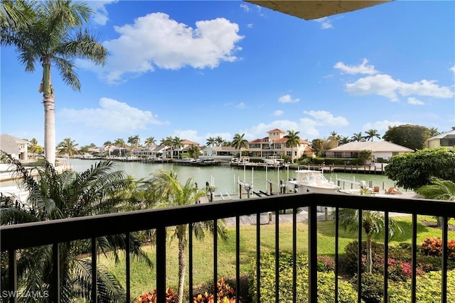 property view of water with a dock and a residential view