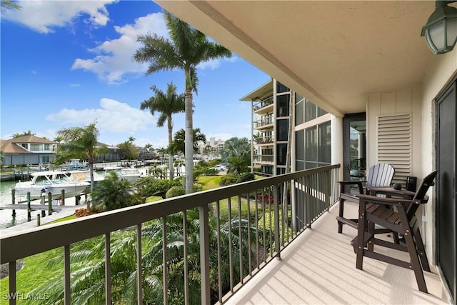 balcony featuring a water view