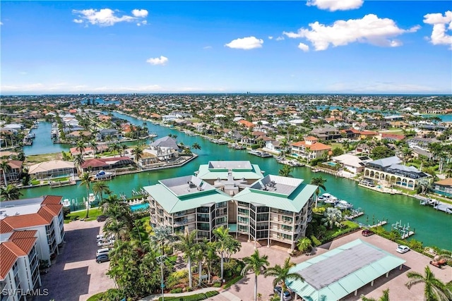 drone / aerial view with a water view and a residential view