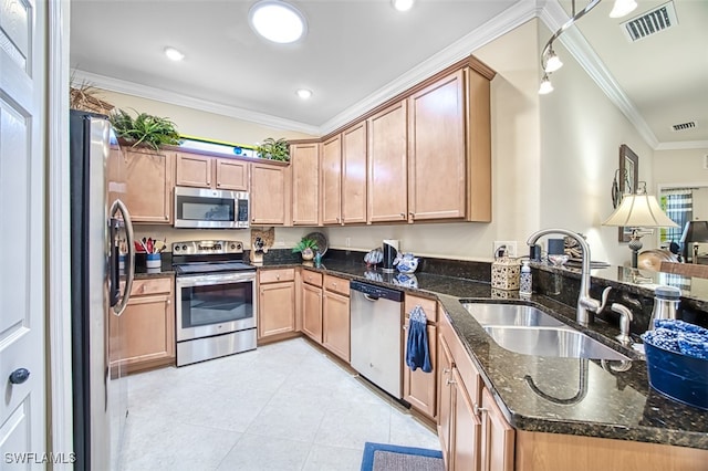 kitchen featuring light tile patterned floors, visible vents, ornamental molding, a sink, and appliances with stainless steel finishes