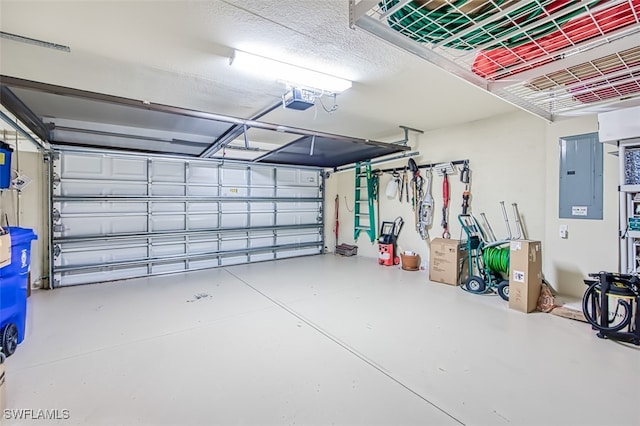 garage with electric panel and a garage door opener