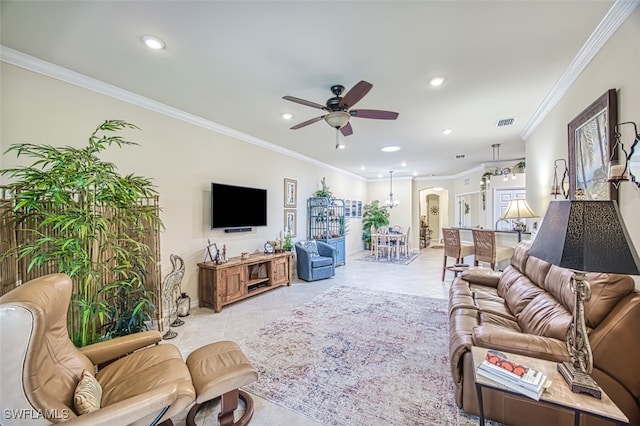 living area with visible vents, ornamental molding, a ceiling fan, recessed lighting, and arched walkways