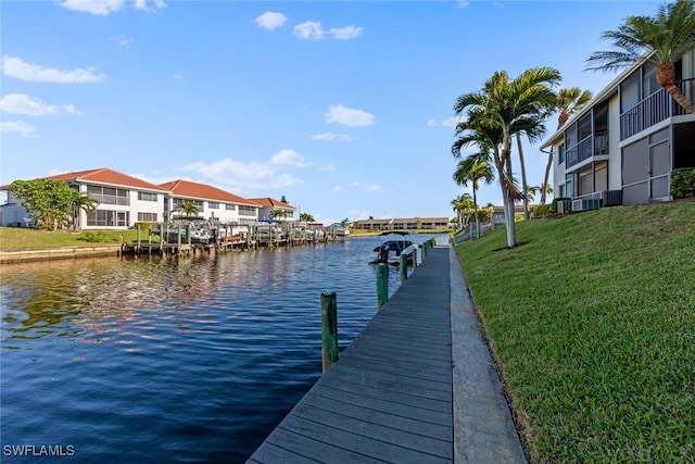 1011 SE 38th Ter Unit 2213, Cape Coral, FL 33904 - dock area featuring a lawn, a water view, and a residential view