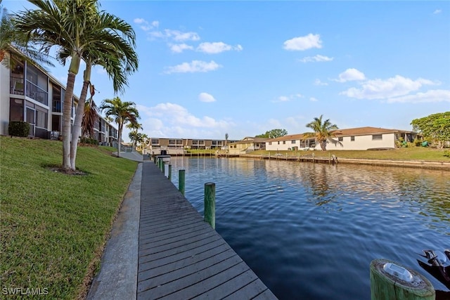 1011 SE 38th Ter Unit 2213, Cape Coral, FL 33904 - dock area featuring a lawn, a water view, and a residential view