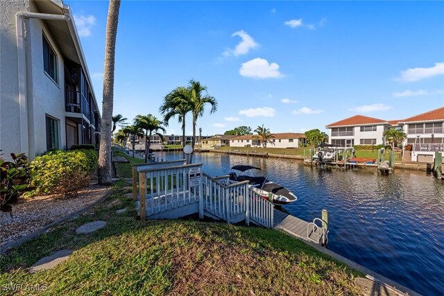 1011 SE 38th Ter Unit 2213, Cape Coral, FL 33904 - view of dock with a water view and a residential view