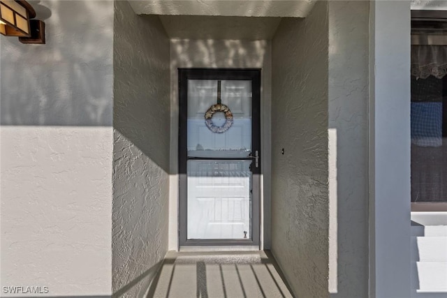 1011 SE 38th Ter Unit 2213, Cape Coral, FL 33904 - view of exterior entry featuring stucco siding