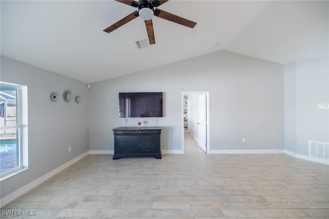 unfurnished living room with light wood-style floors, lofted ceiling, a ceiling fan, and visible vents