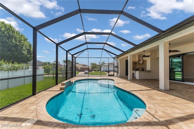 view of pool featuring a fenced in pool, ceiling fan, fence, a lanai, and a patio