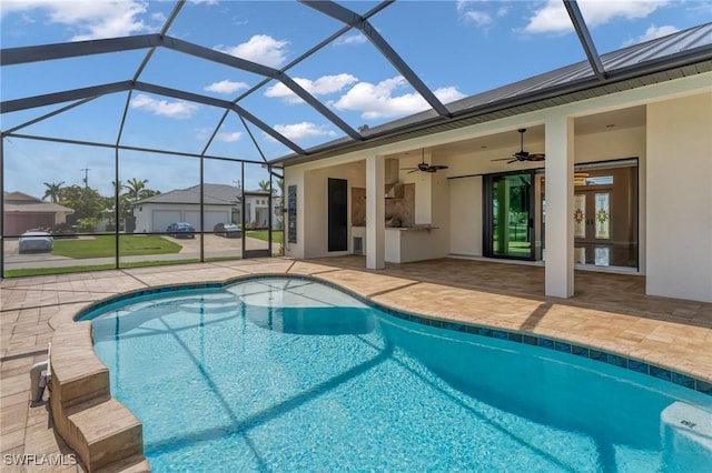 outdoor pool featuring a lanai, ceiling fan, and a patio