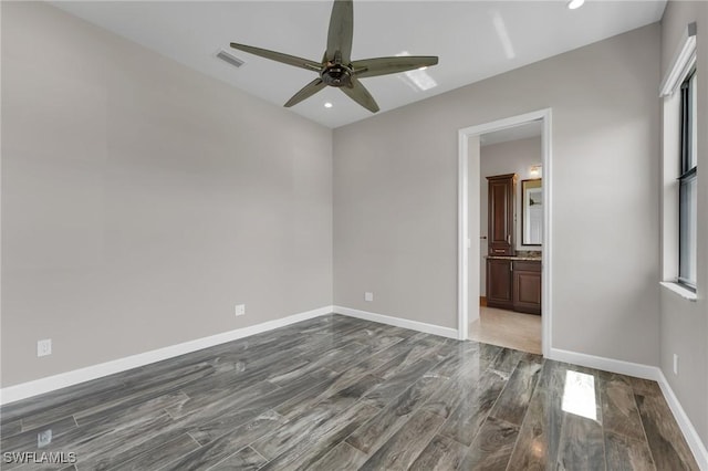 unfurnished bedroom with dark wood-style floors, recessed lighting, baseboards, and visible vents