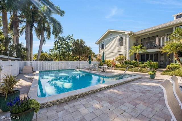 view of pool with a fenced in pool, a fenced backyard, and a patio area