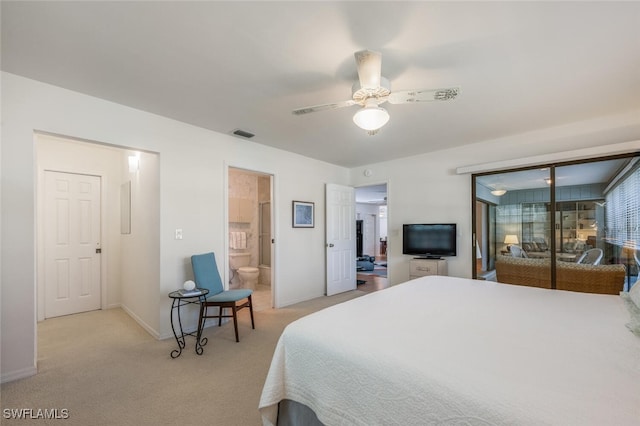 bedroom featuring a ceiling fan, visible vents, baseboards, light colored carpet, and connected bathroom