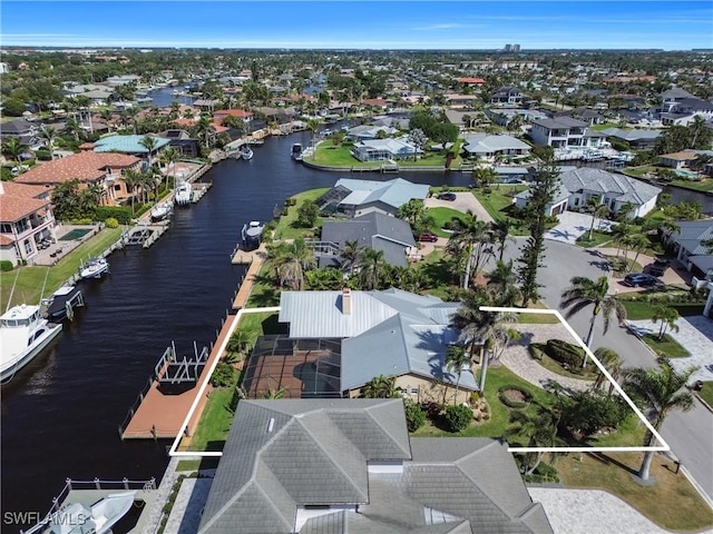 birds eye view of property featuring a residential view and a water view