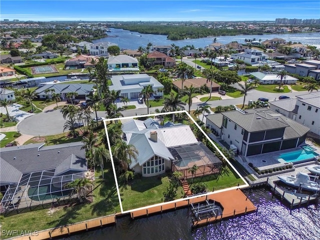 aerial view featuring a residential view and a water view