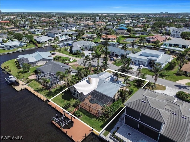 bird's eye view featuring a residential view and a water view